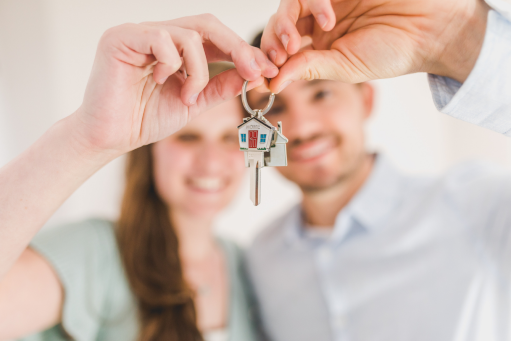 first time modular home buyers holding their key